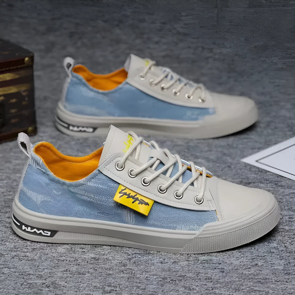 Men's dark blue round toe canvas shoes with white laces and a rubber sole.