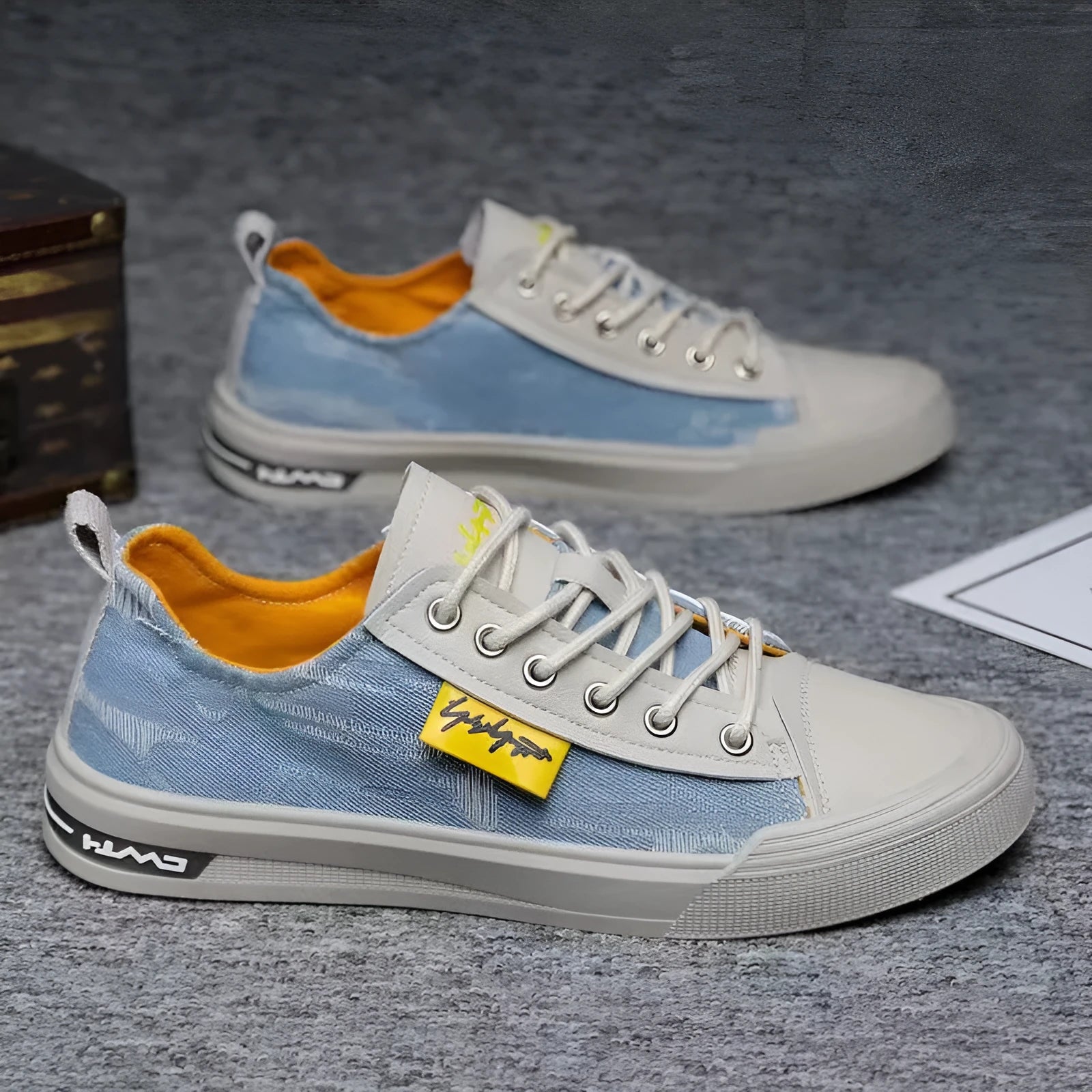 Men's dark blue round toe canvas shoes with white laces and a rubber sole.