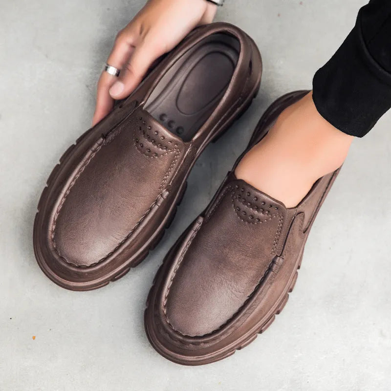 Men's black mid-top slip-on work shoes with platform sole, artificial leather upper, and round toe