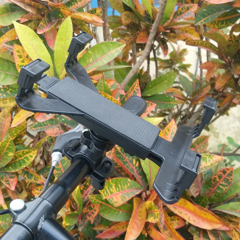 Black bicycle tablet computer stand with adjustable clamp holding an iPad, three-sided sponge padding visible