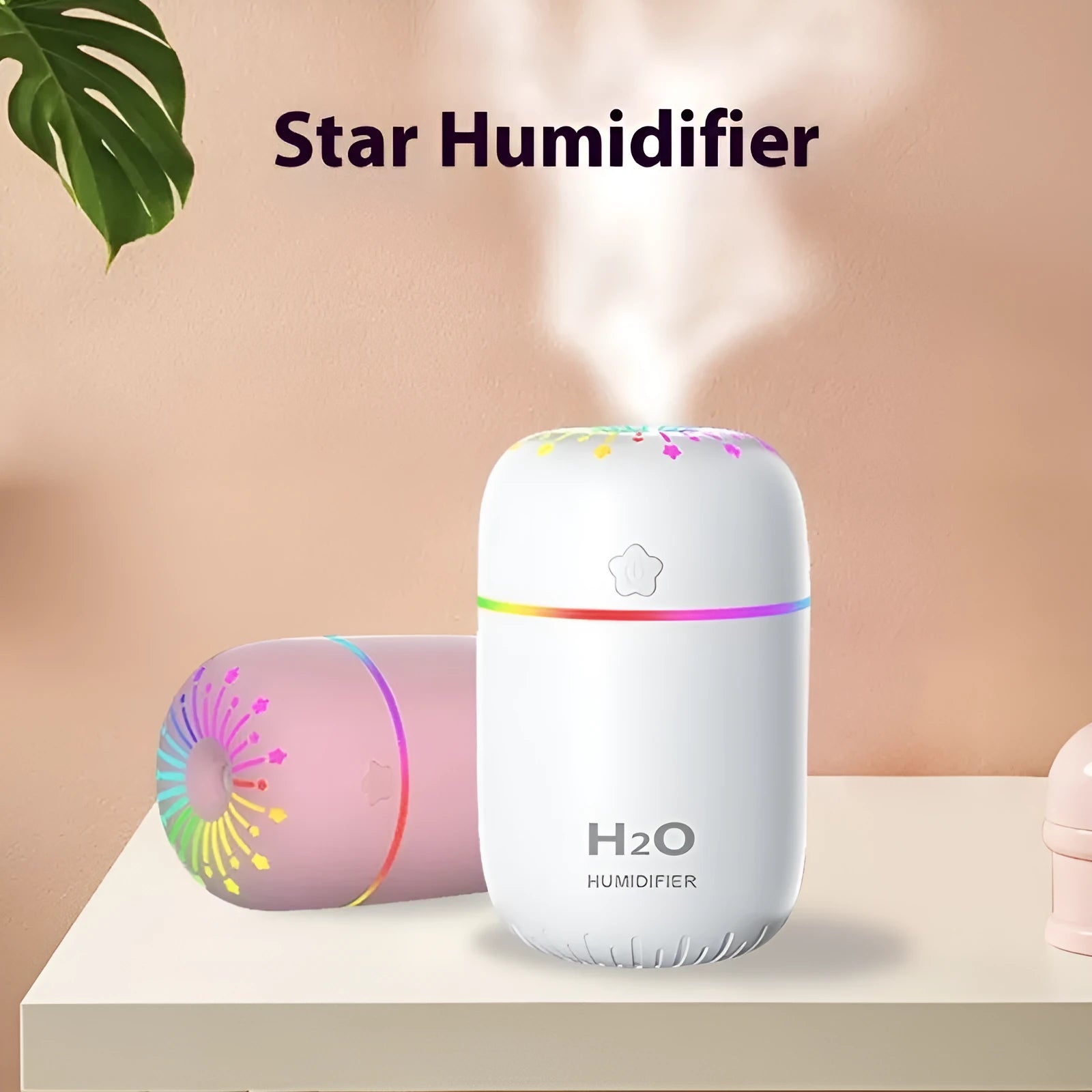 Small white USB desktop humidifier with water tank on a wooden desk.