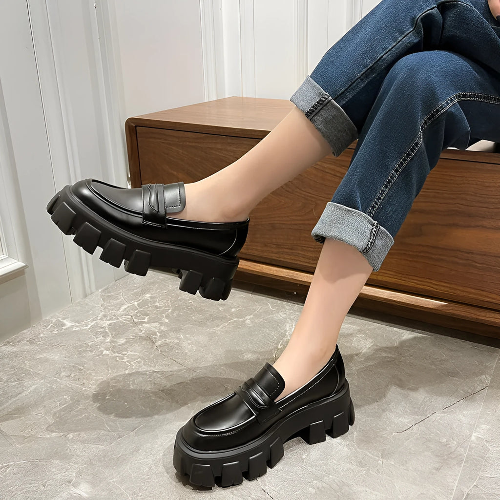 British style wide fit loafers in patent leather and matte finishes on a muffin base rubber sole.
