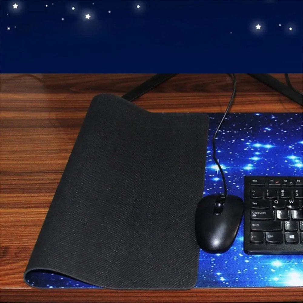 Blue star mouse pad with high-density fabric surface and anti-skid rubber base on a desk