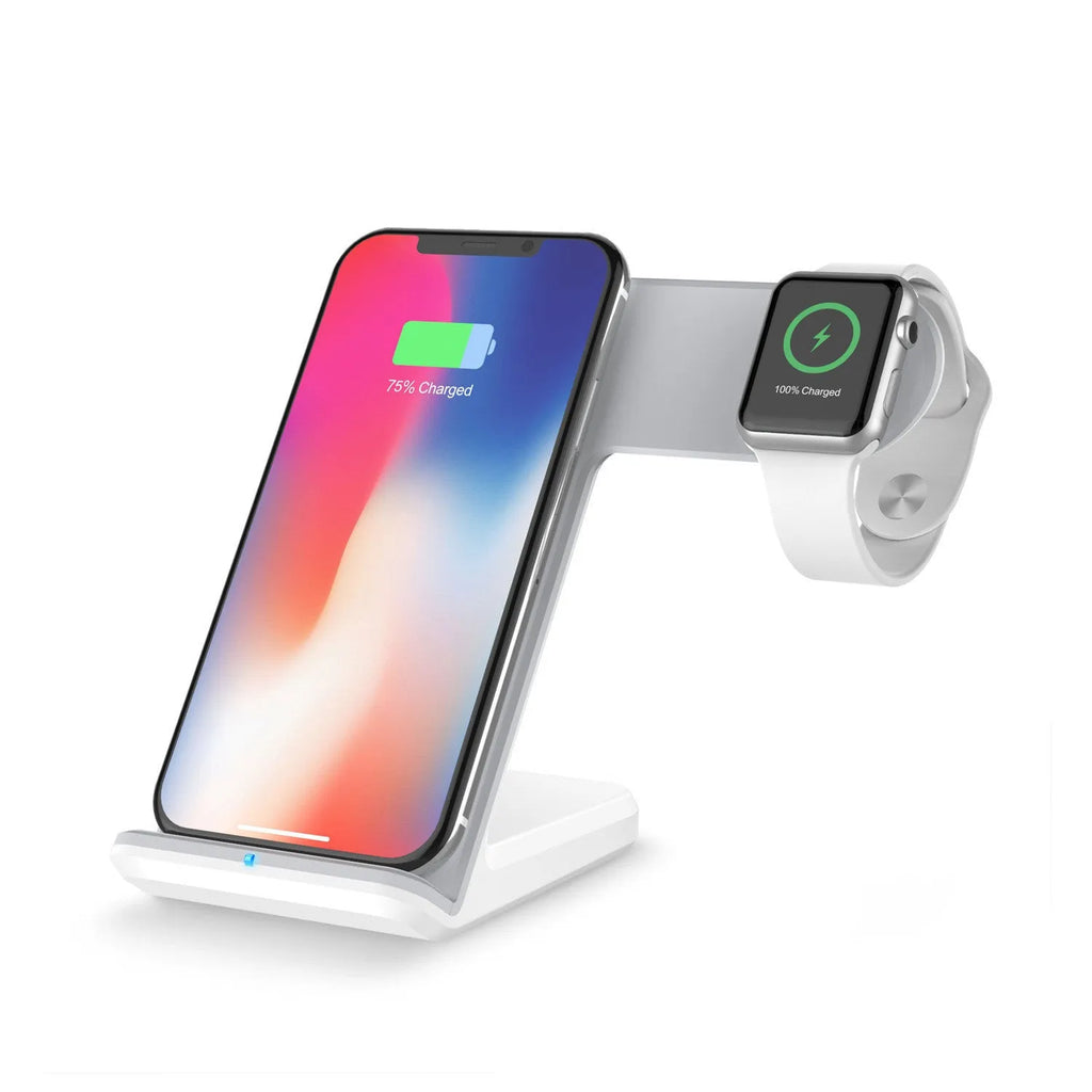 Black wireless charging pad for mobile phones on a wooden desk with a smartphone placed on top.