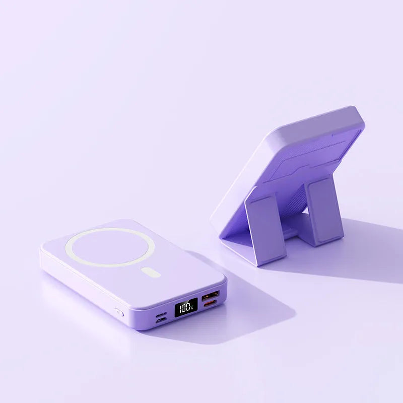 Magnetic wireless power bank with bracket in white, showing 10000mAh capacity and USB port, on a desk