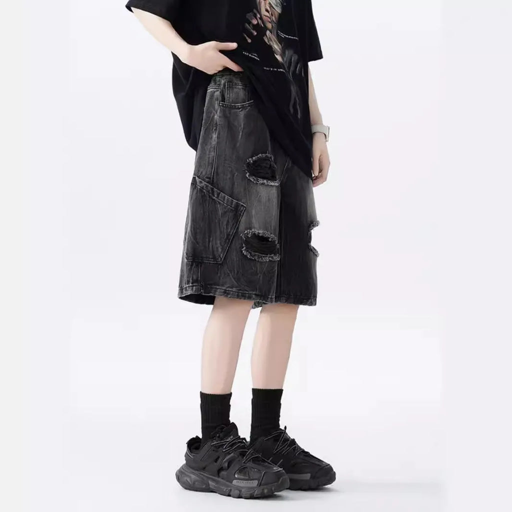 Men's washed denim shorts with ripped detailing in black or blue, showing loose retro style and fifth-pants length