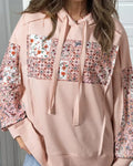 Women's pullover hoodie with drawstrings, loose fit, long sleeves, in pink colour, front view