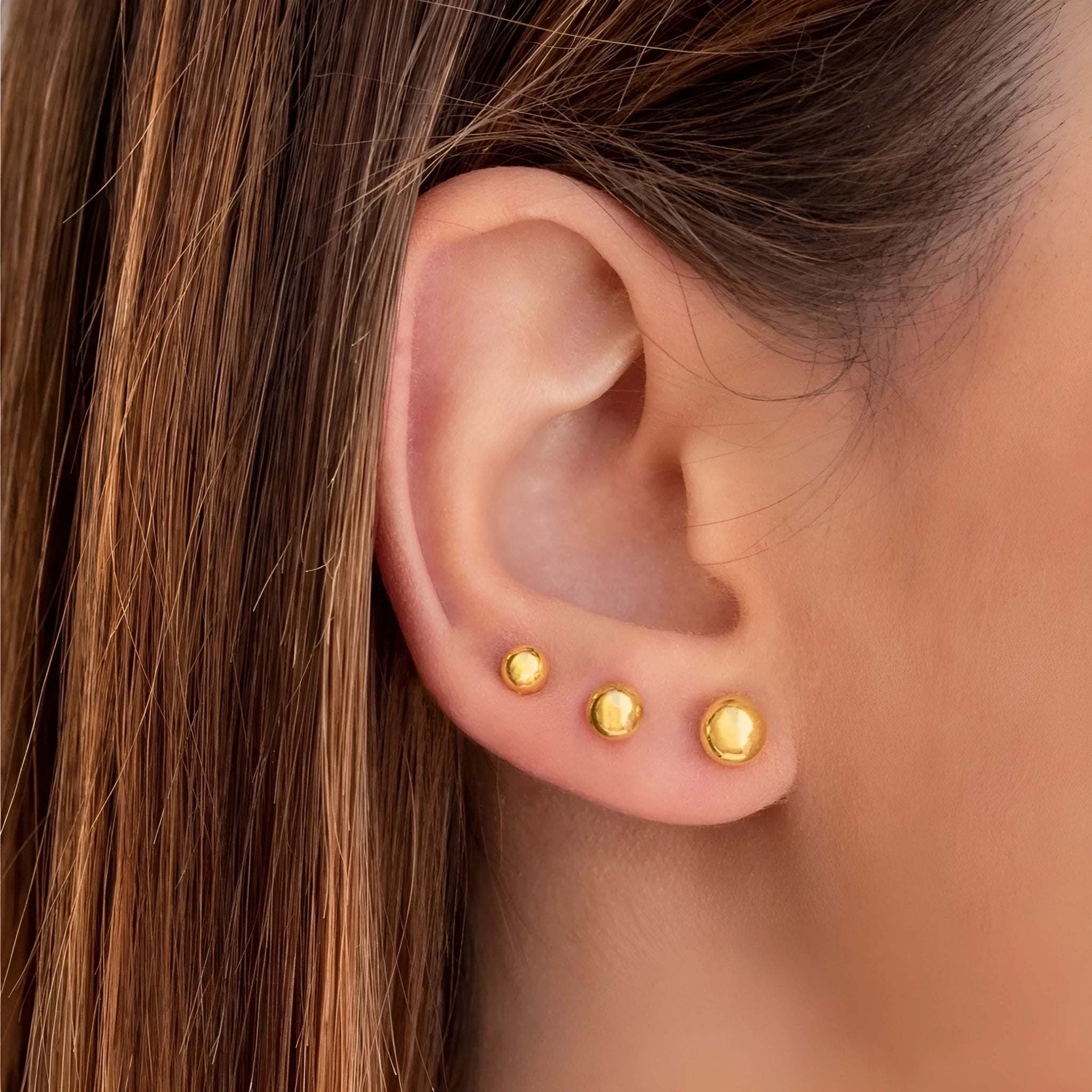 Minimalist stainless steel ball stud earrings in gold or silver, showing 3mm, 4mm, 5mm, and 6mm size options.