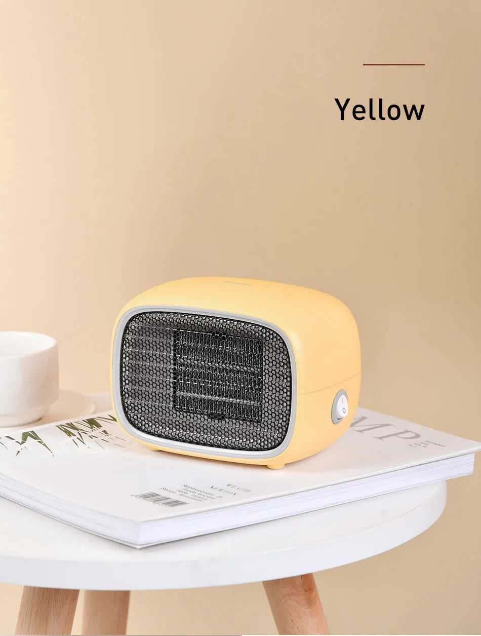 Compact green mini ceramic desk heater with metal grille, shown with dimensions.