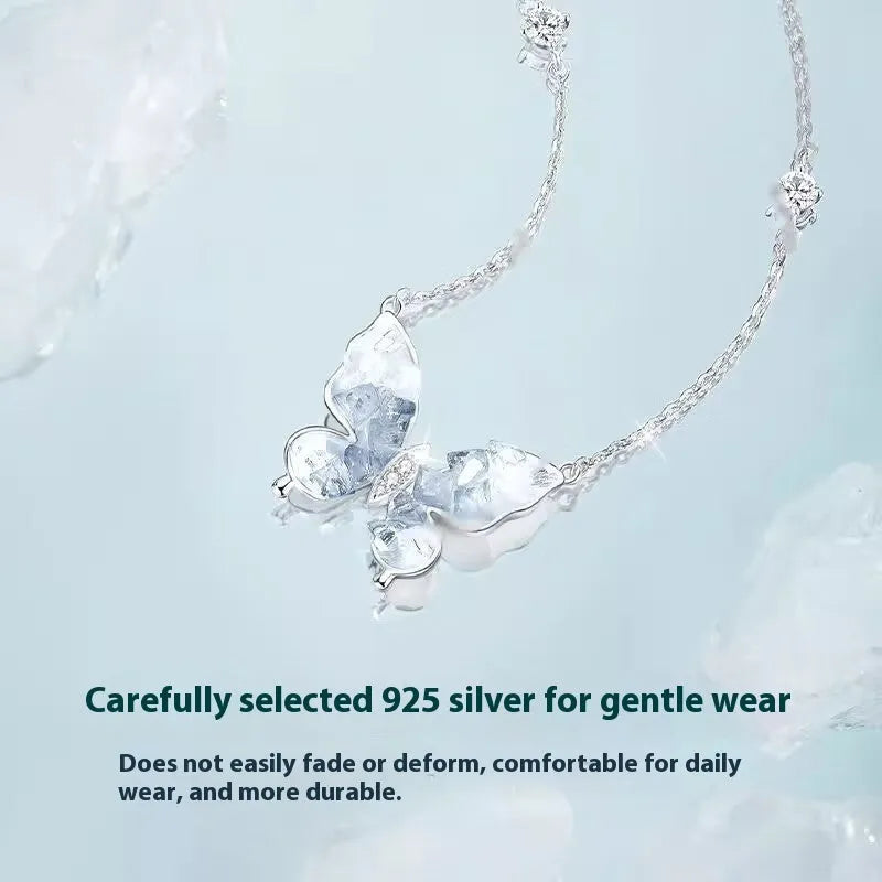 S925 sterling silver butterfly pendant necklace on an O-ring chain, showing electroplated ice rain detail.