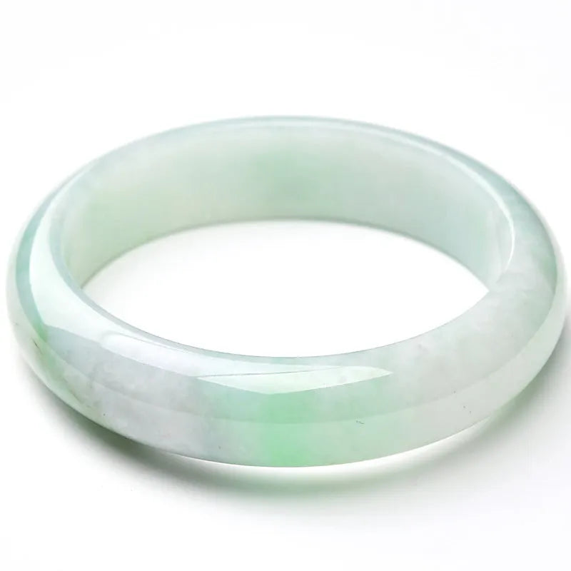 Light green jade bracelet showing natural stone material on wrist