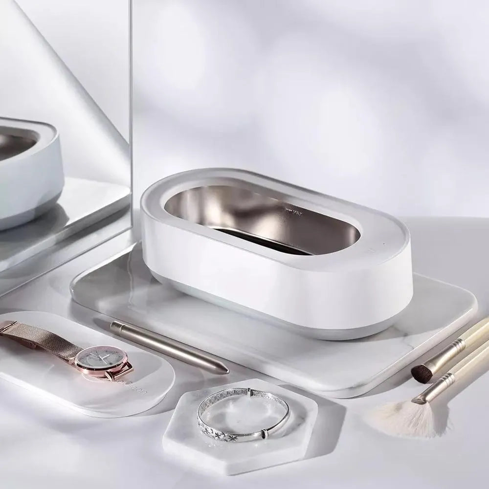 White portable ultrasonic cleaning machine with stainless steel tank and digital timer display.