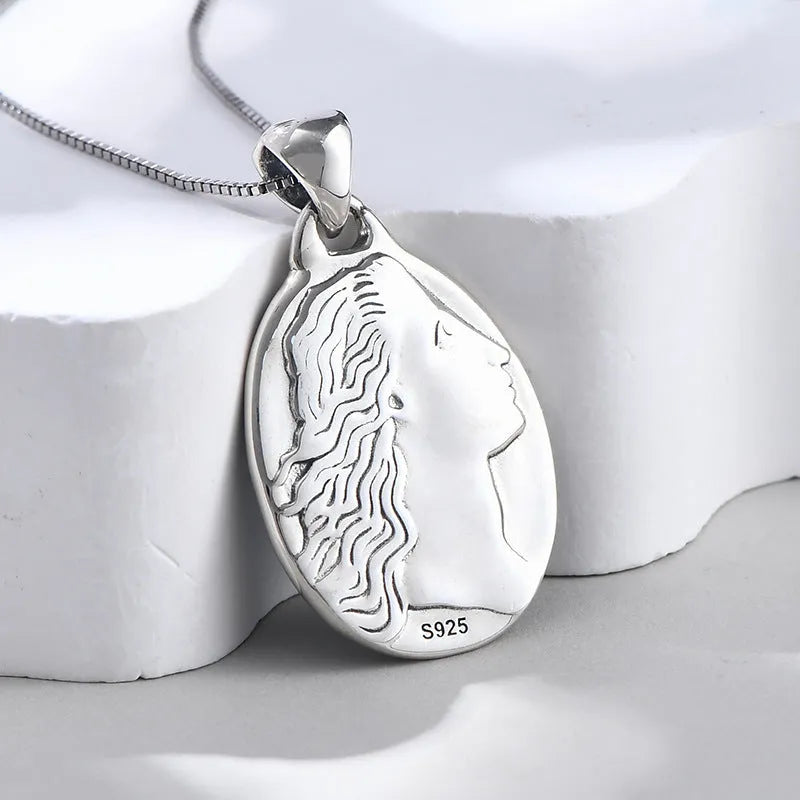 S925 sterling silver pendant with embossed blue and white agate oval portrait on white background