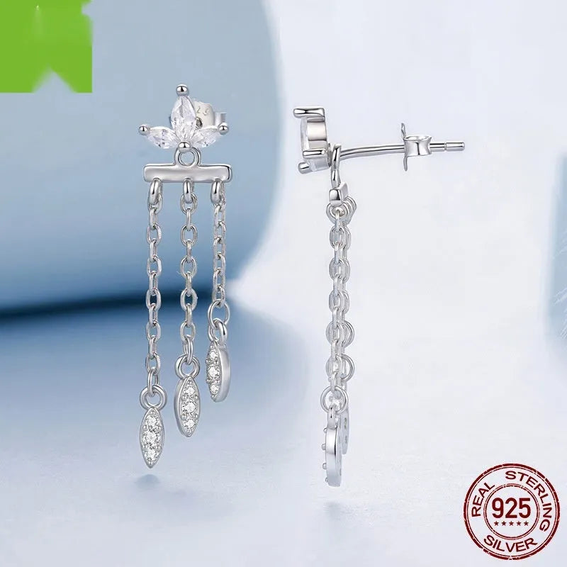 Pair of silver ear studs with small flower and tassel front and rear structure, BSE1240 colour, on light background