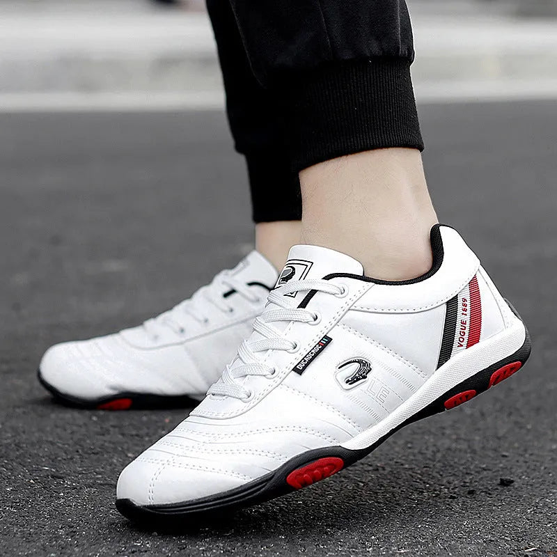 Men's casual sneakers with white space leather upper, round toe, and flat heel on a plain background