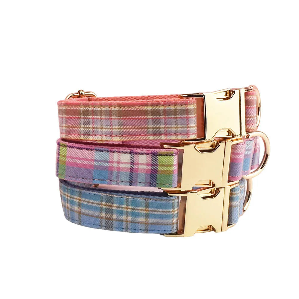 Sky blue grid forest pattern dog collar, leash, bow, and vest four-piece set on white background