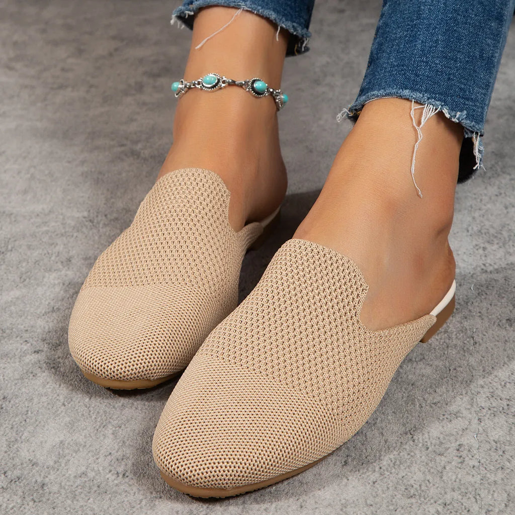 Women's apricot coloured cloth mesh slip-on sandals with a flat rubber sole on a white background.