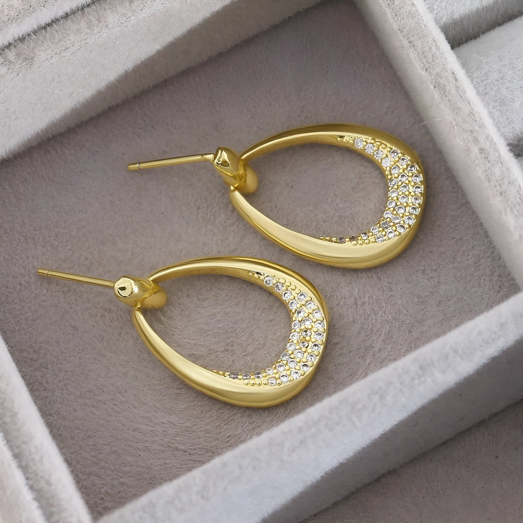 Yellow gold geometric drop earrings with zircon accents measuring 2.6cm x 1.7cm