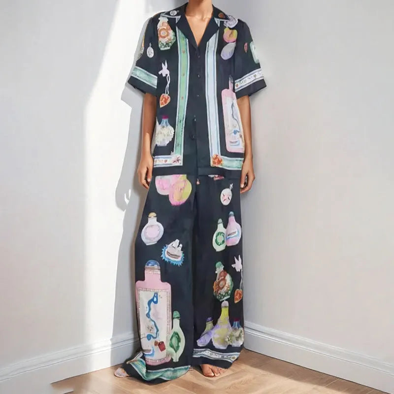 Black women's casual set with cartoon print, featuring a cardigan and matching trousers