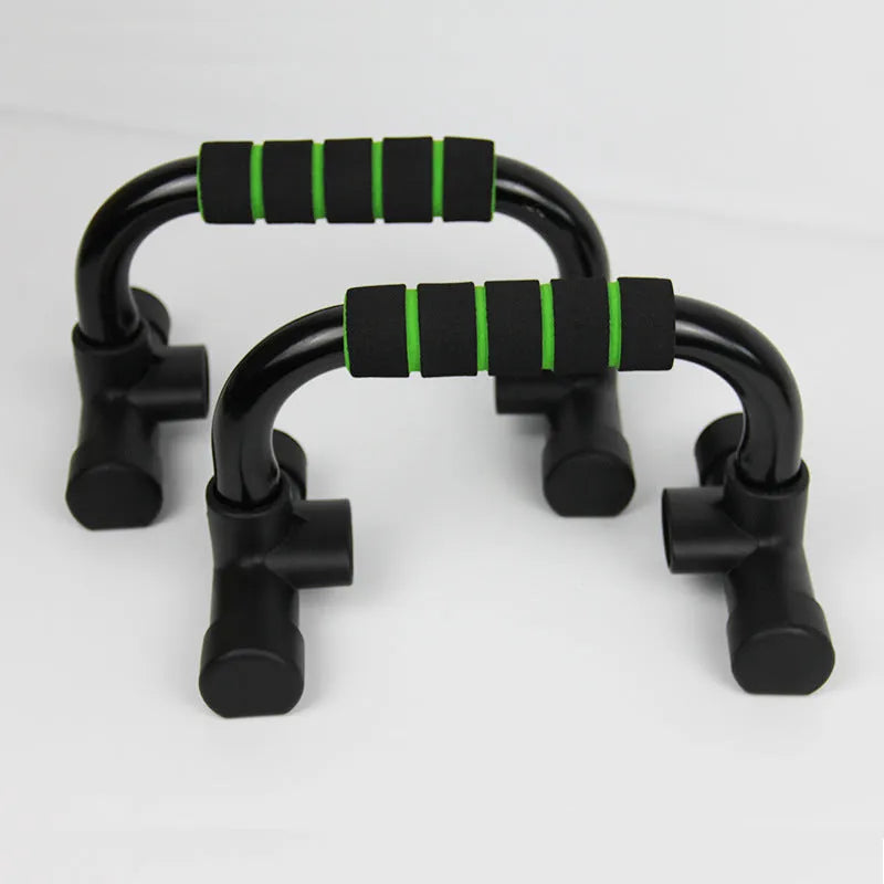 Green suction cup push up stand with electroplated steel frame and foam handles on a smooth floor