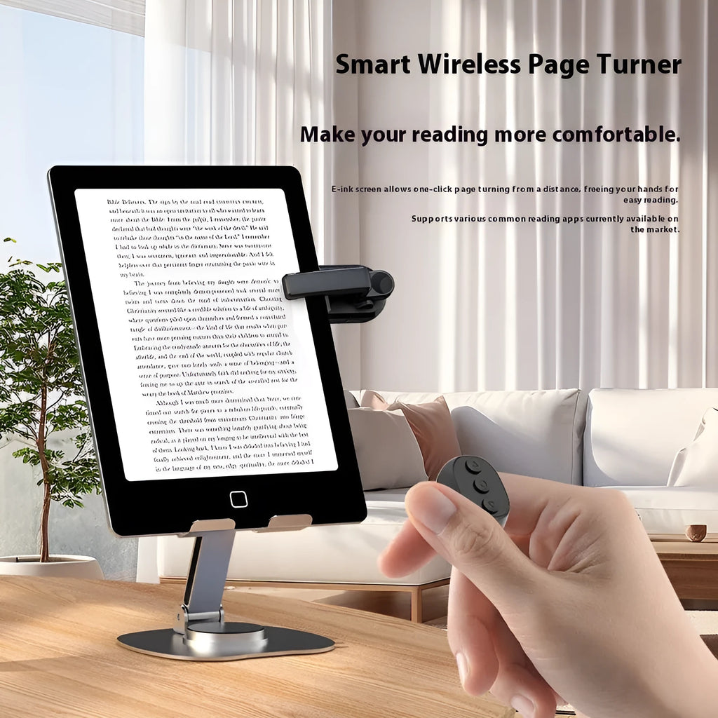 Black wireless page turner remote and clicker for tablets on a wooden table.