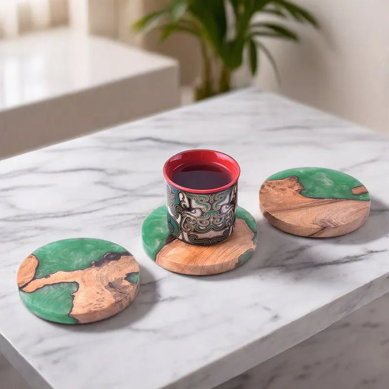 A solid colour resin coaster on a wooden table, showing its 1cm thickness and irregular Nordic shape.