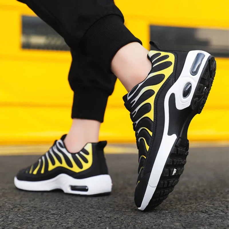 Colour-blocked lace-up sneakers for men with breathable fabric upper, rubber sole, and air cushion support in black and grey