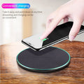 Black circular Qi wireless charger for iPhone 11 with non-slip base