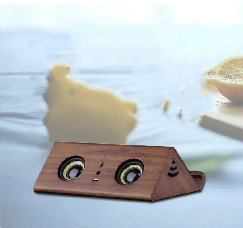 Bronze wooden home speaker with wooden shell, 3.5mm connection, and control panel on top