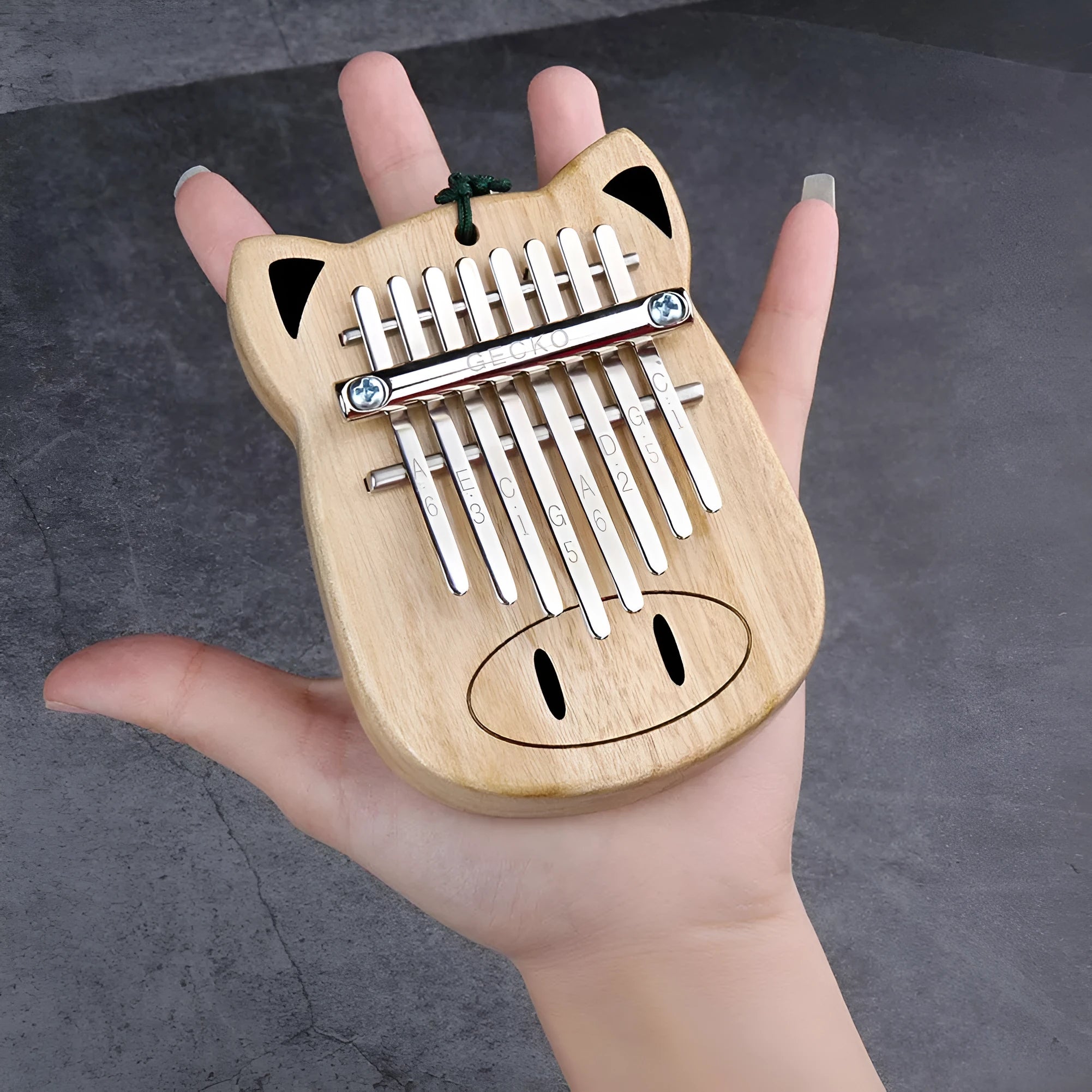 Camphorwood Mini K8 keyboard percussion instrument with five sounds in Piggy colour, 11.5 x 9 x 3 cm, with long and short lanyards