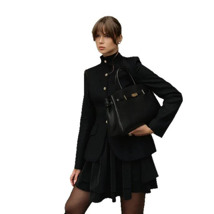 Women's black solid colour stand collar suit set with blazer and short dress on display