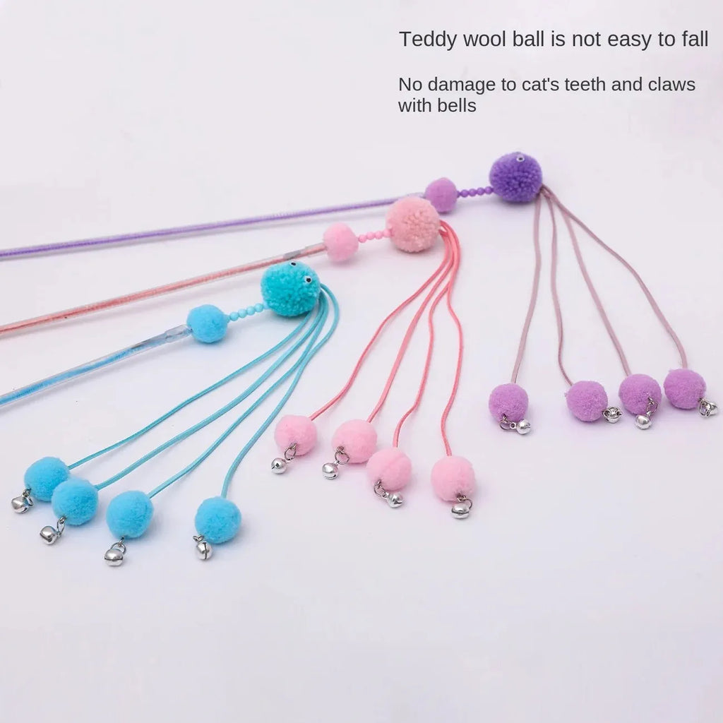 Blue cat toy wand with a fluffy tassel on a stick for interactive pet play.