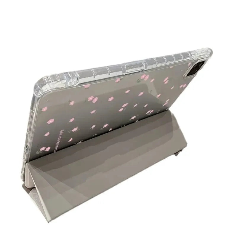 Transparent floral patterned iPad case showing three-fold magnetic stand positions