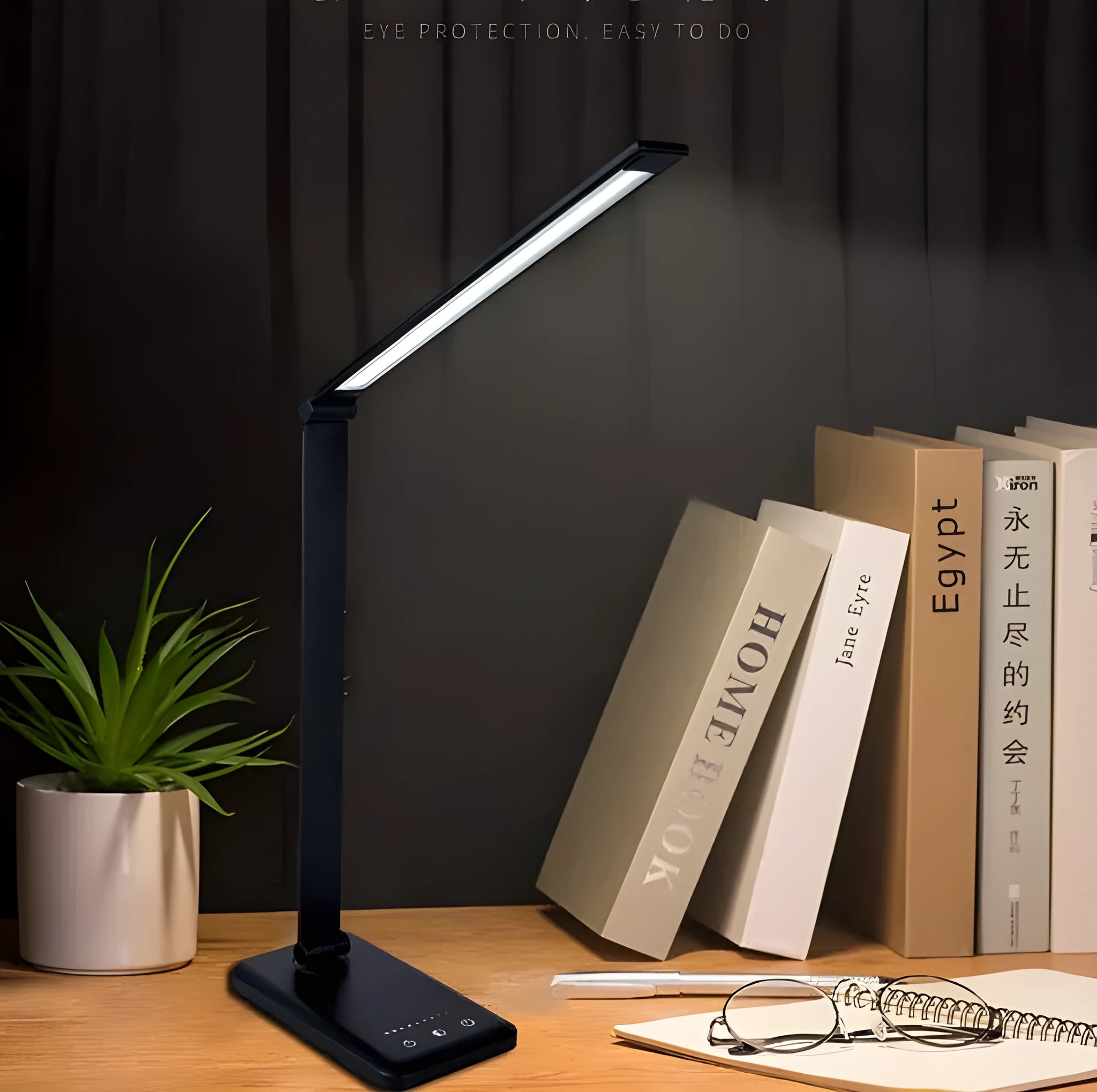 LED desk lamp with wireless charging base and foldable arm in black