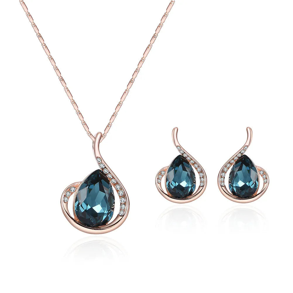 Rose gold alloy necklace and earrings bridal set with diamond crystal pendant and artificial gem inlay