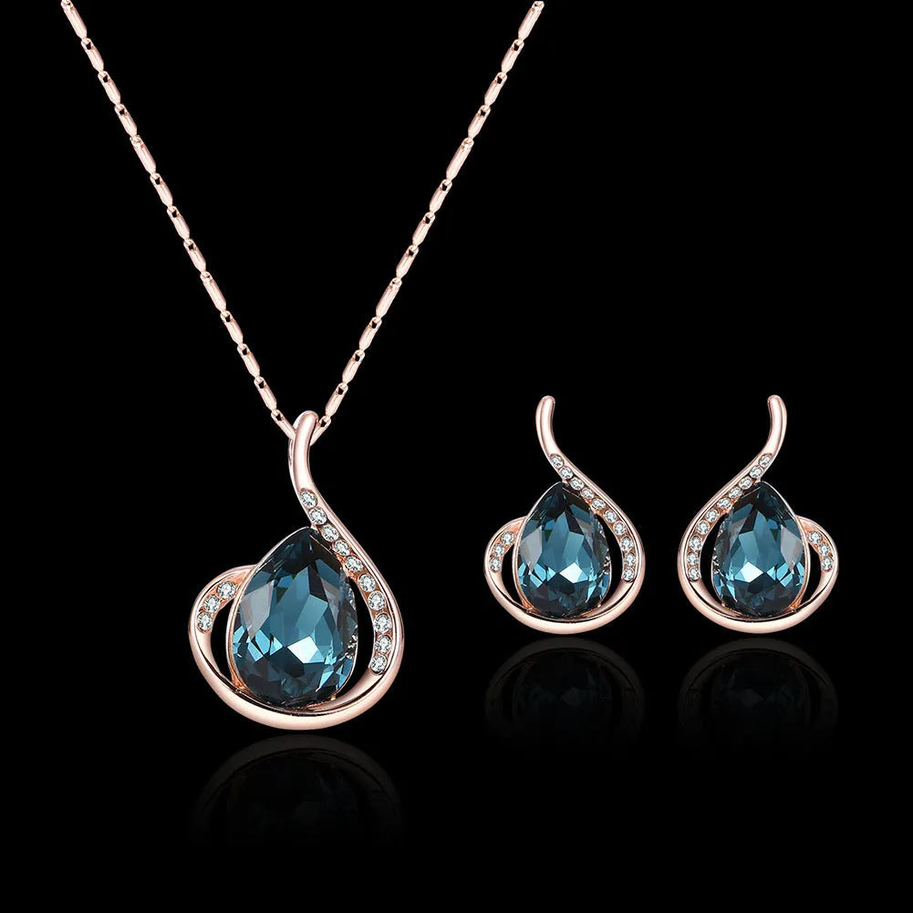 Rose gold alloy necklace and earrings bridal set with diamond crystal pendant and artificial gem inlay