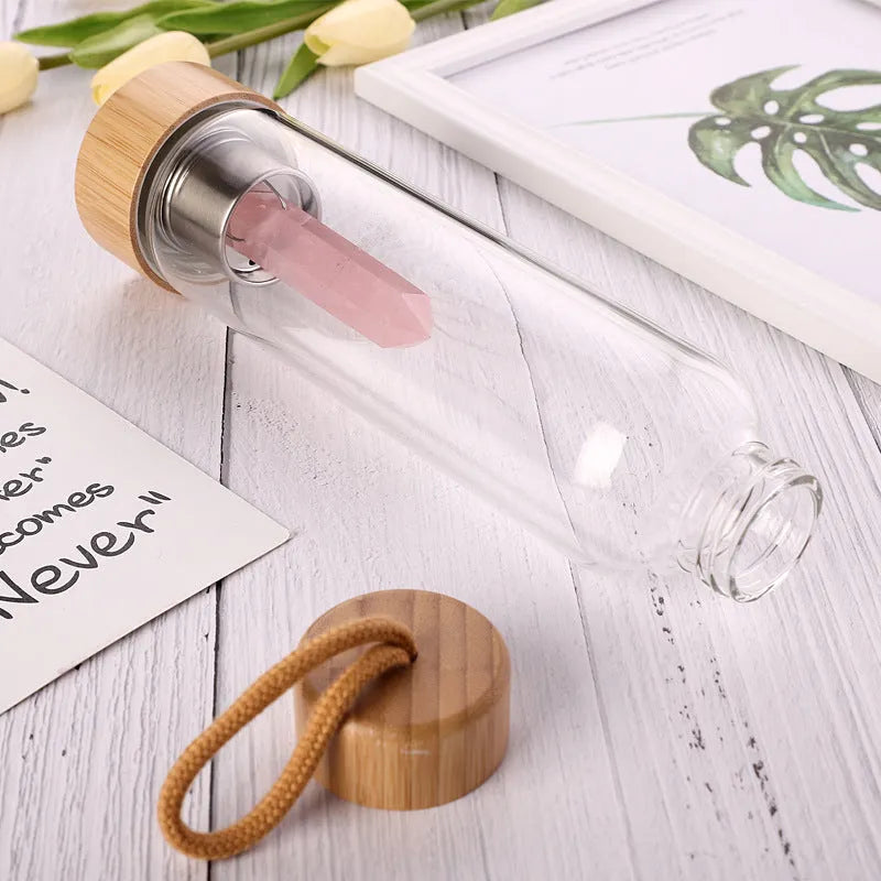 Crystal infused glass water bottle with bamboo lid and crystal stone in black colour