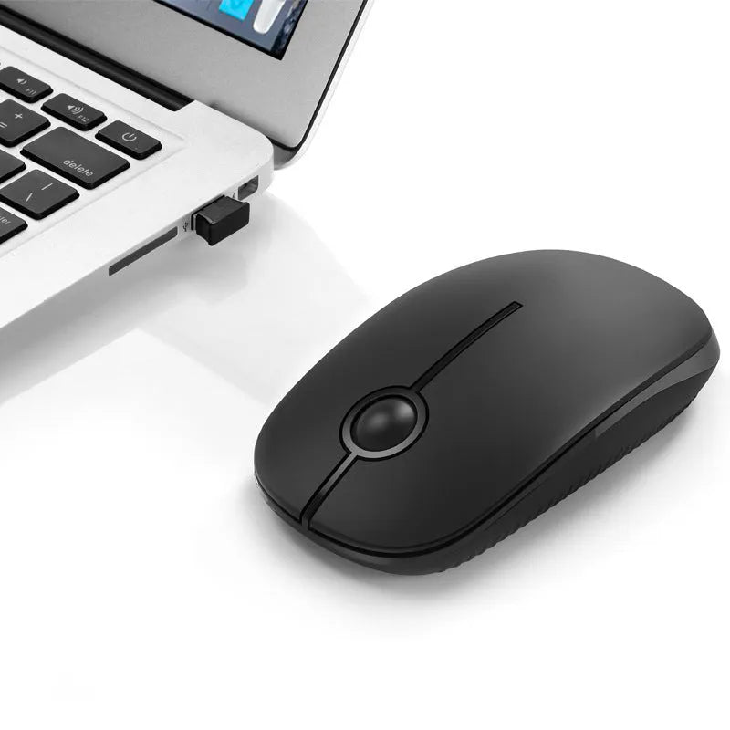 2.4G wireless mouse in black with compact design on flat surface