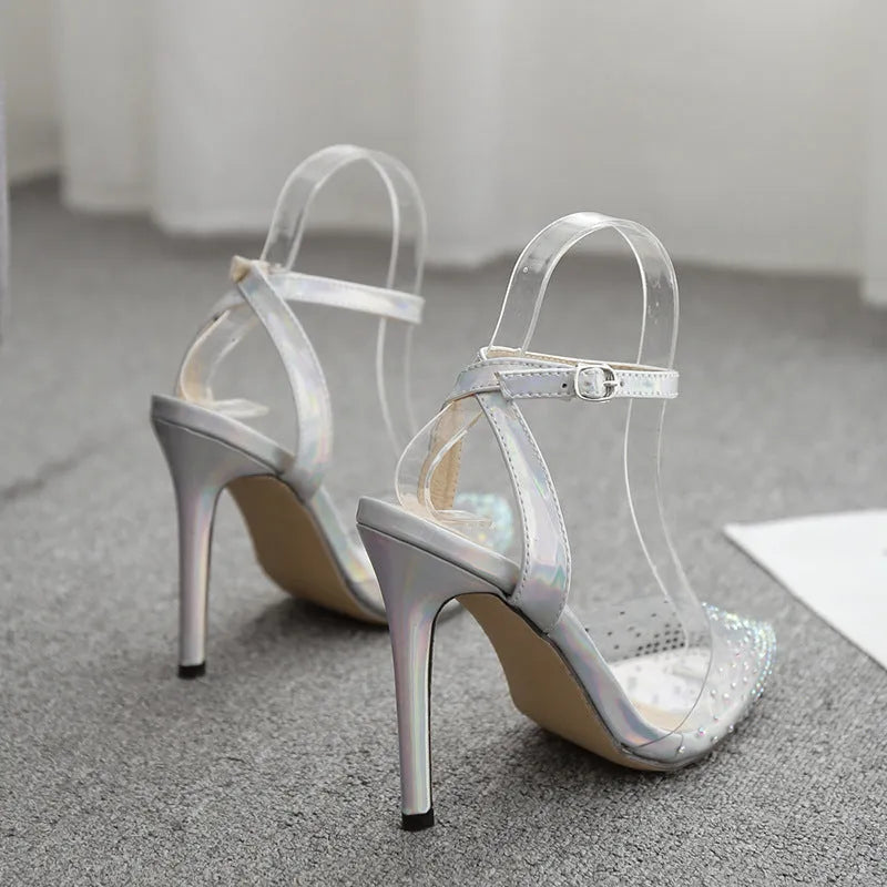 Women's pointed toe stiletto sandals with diamond details on a PVC upper, showcasing a 9cm heel.