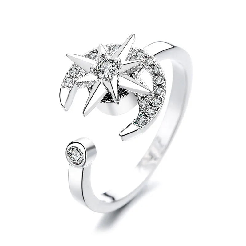 Gold tone adjustable spinner ring with rotating band and bee daisy design with blue zircon stones