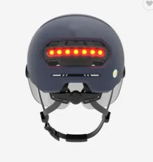 Cycling helmet with integrated red LED tail light on the back, shown in sizes M and L.