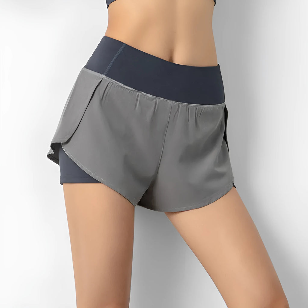 2-in-1 active shorts in Light Blue, polyester fibre, size M, flat lay view showing outer short and built-in liner
