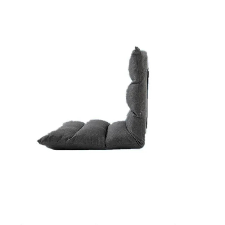 Beige lazy sofa floor chair with adjustable backrest on living room floor showing six-angle mechanism