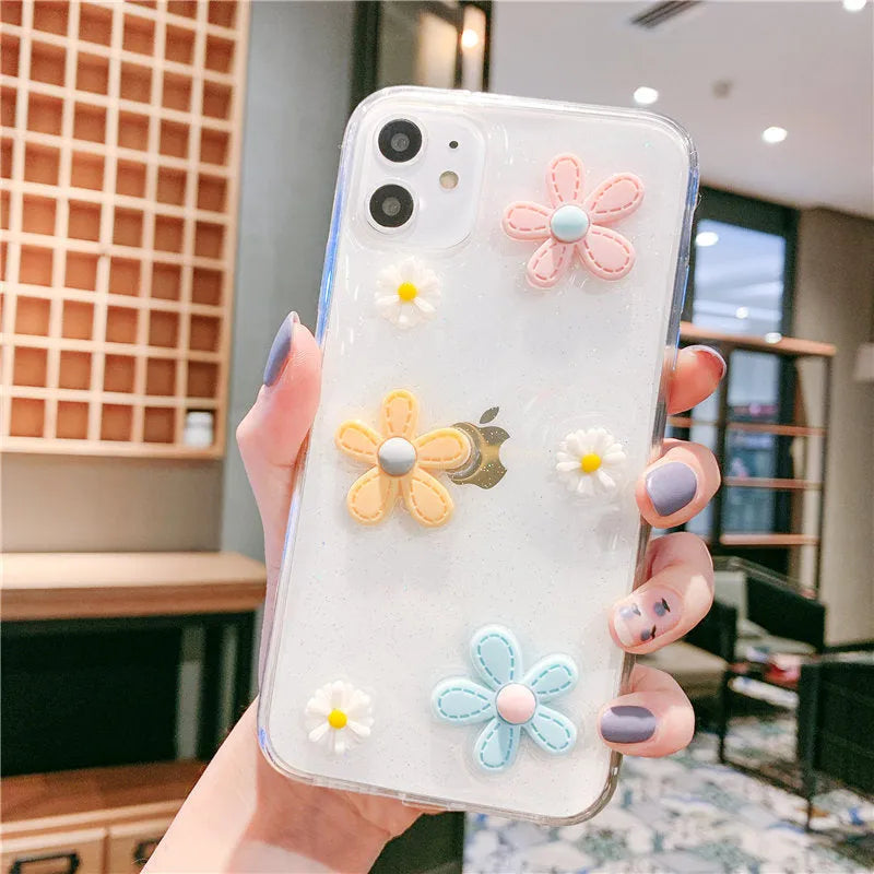 Soft rubber iPhone case with pink floral and girl heart pattern, shown fitted on a phone.
