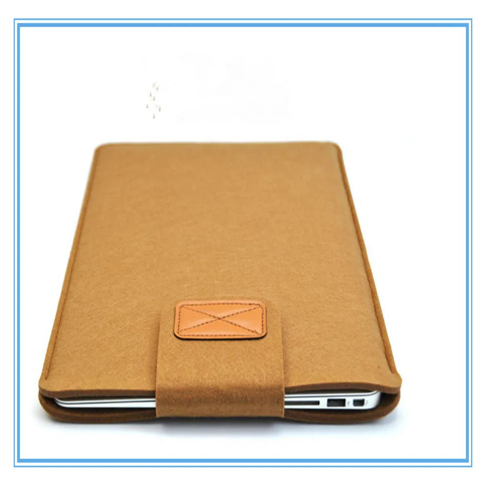 Dark grey clamshell laptop bag open to show plush felt interior for a 14-inch notebook.