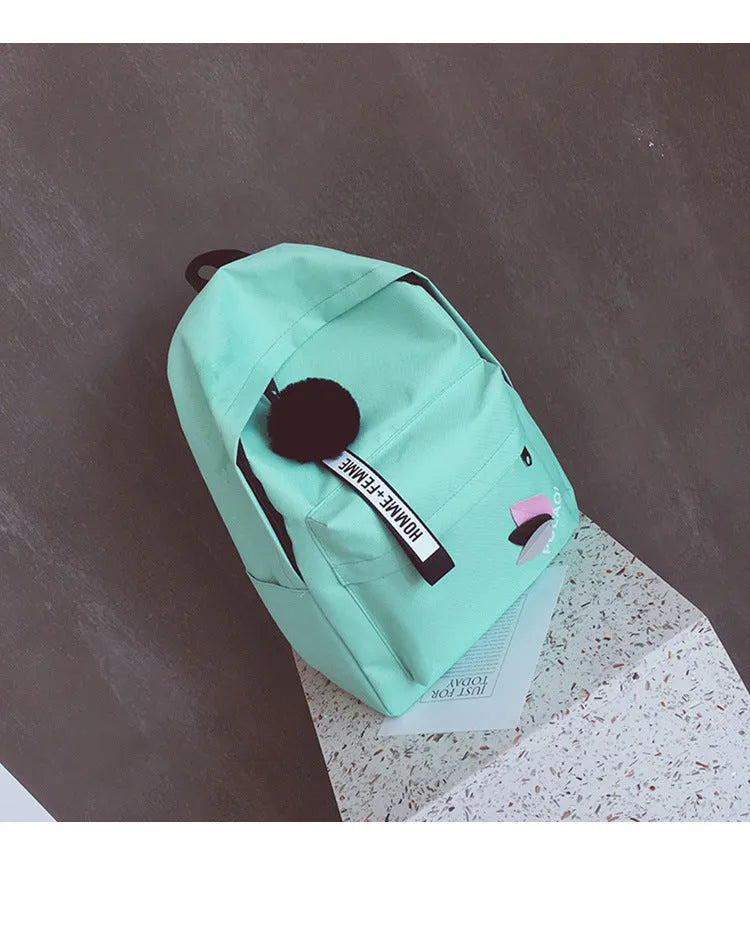 Green canvas college schoolbag with casual styling and anti-theft features