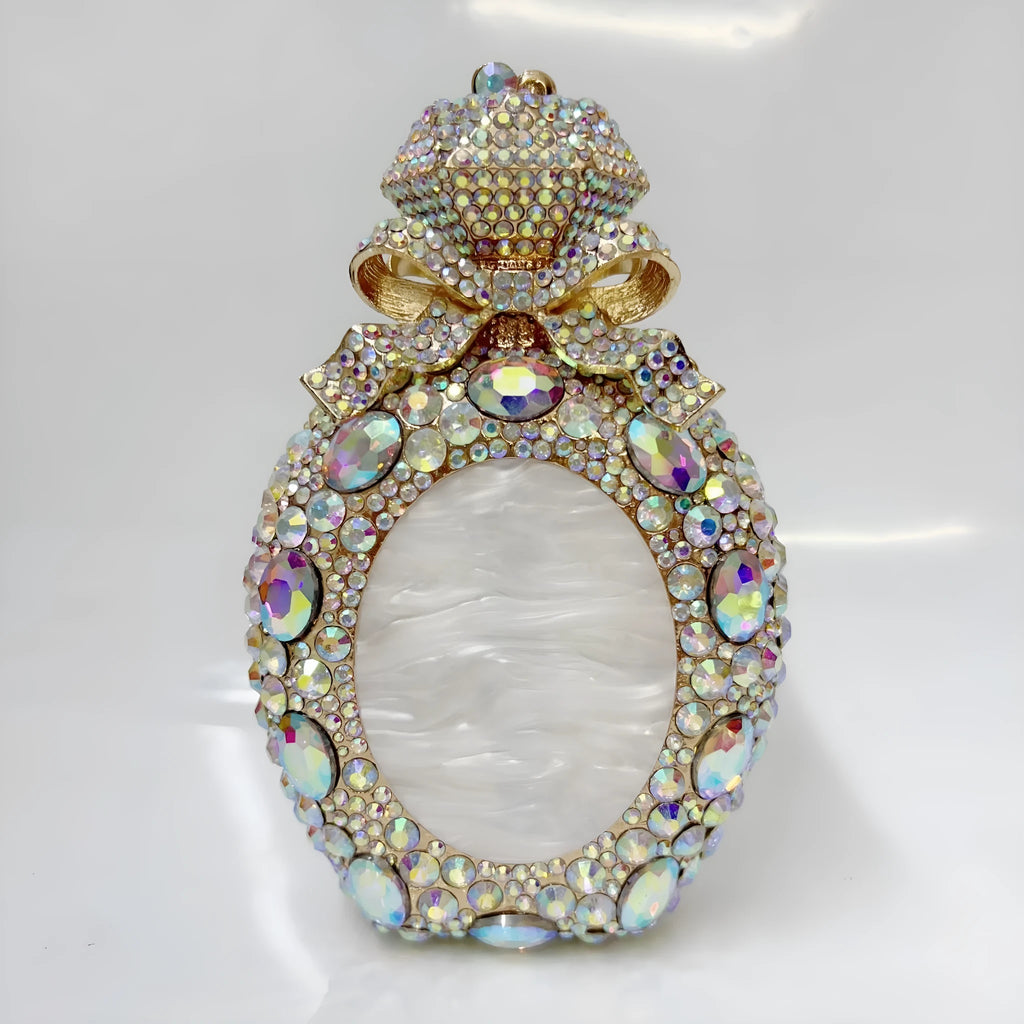 Women's alloy clutch bag with three-dimensional design in metallic colours