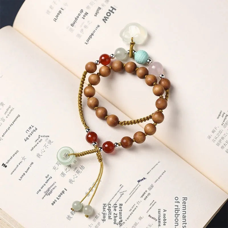 Hand-woven ebony double ring bracelet for women in national style with Ruyi motif.