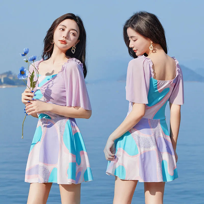 Women's light purple floral high-waist one-piece swimsuit with a central bowknot detail.