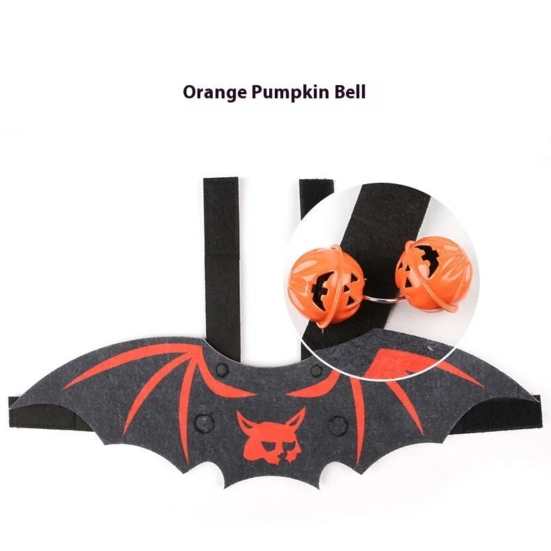 Halloween costume for a cat shaped like black bat wings, shown in orange pumpkin variant.